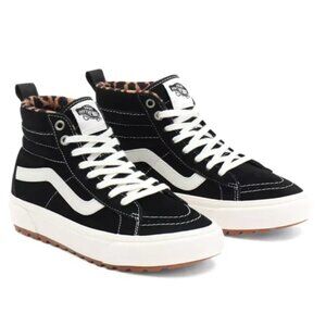 Brand new, never worn, women’s black and white platform Van’s sneakers.